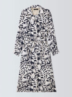 Long black and white patterned dress on a light gray background