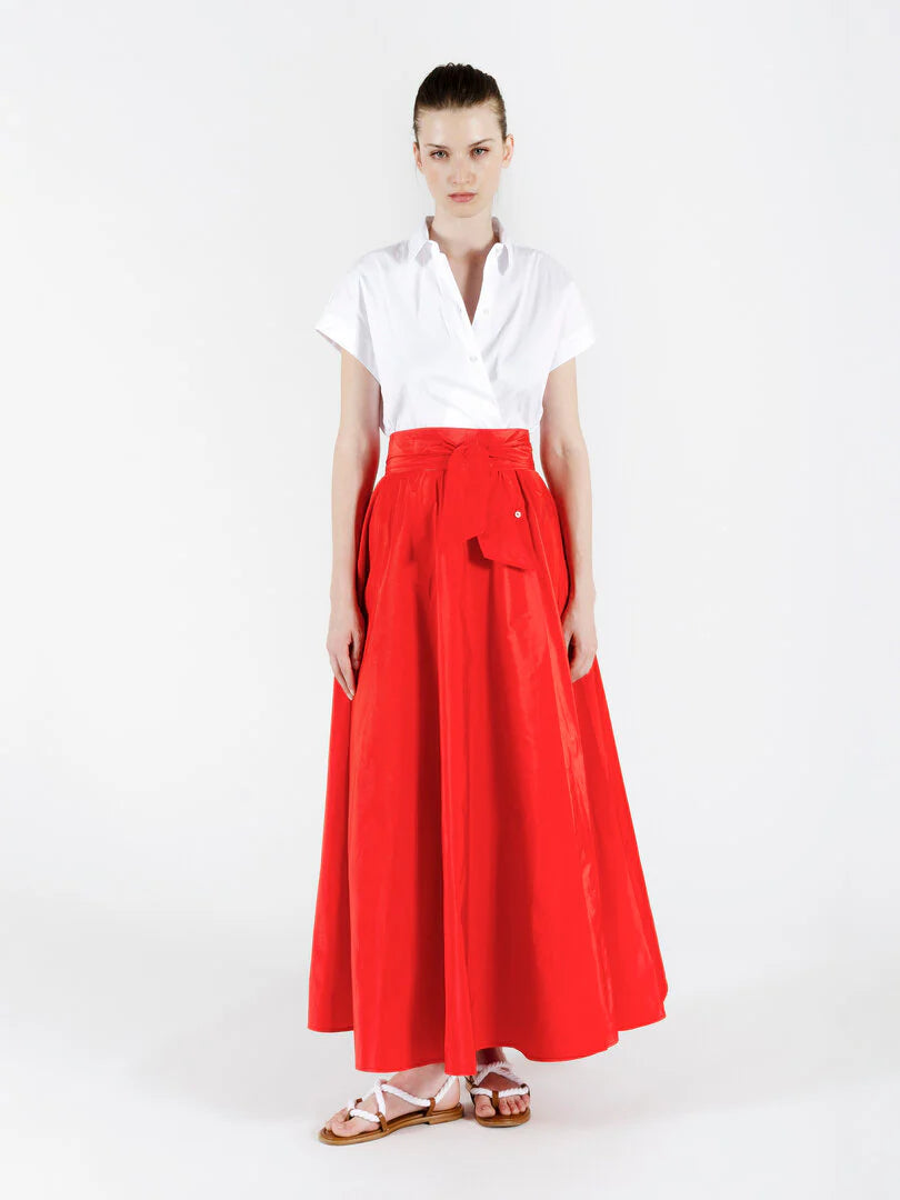 Woman wearing a SARA ROKA white and red dress in  a white background. shop online