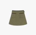 Green skirt with black trim on a white background