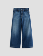 Blue jeans on a light gray background