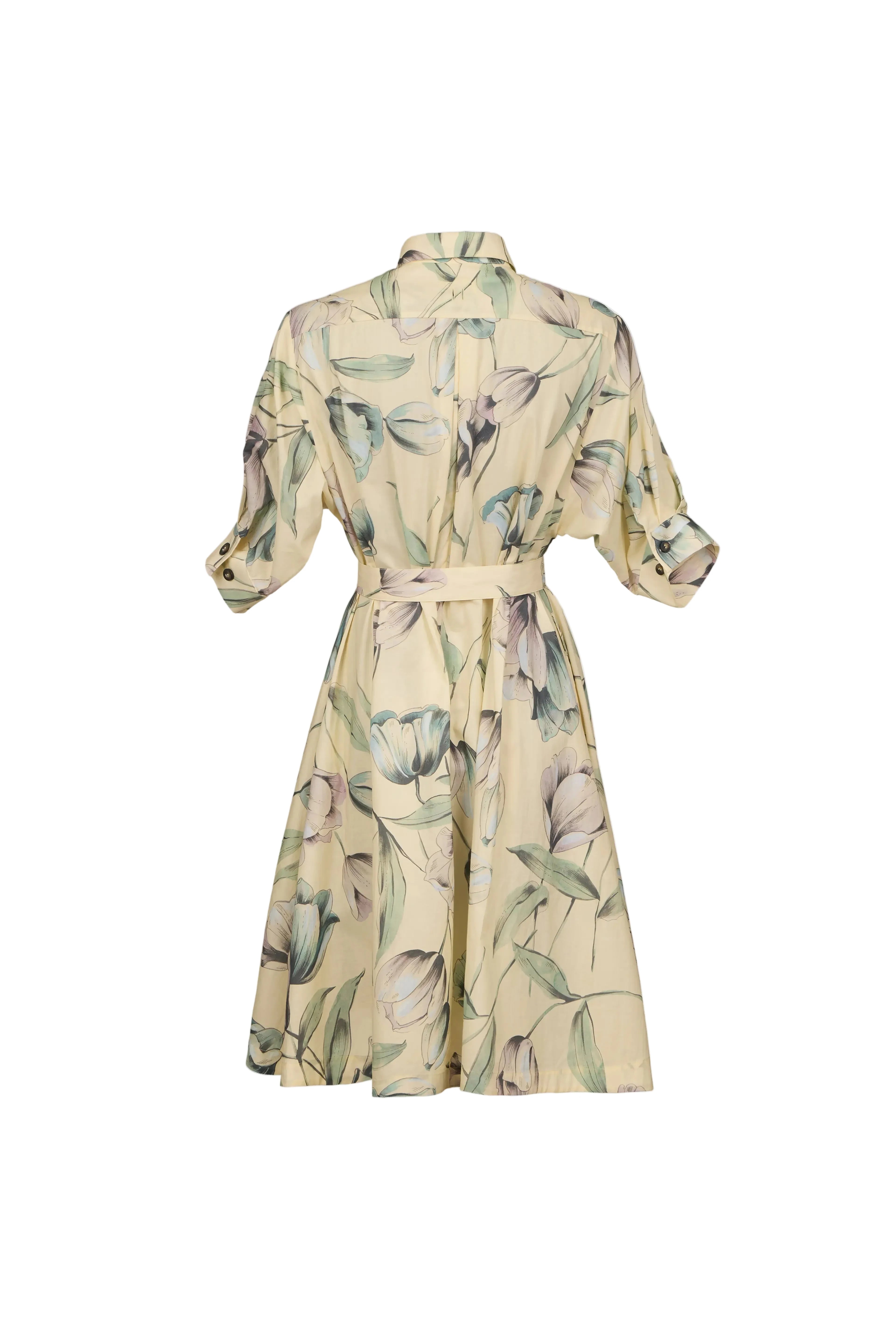A cream-colored shirt dress with a green and gray floral print, featuring three-quarter sleeves and a matching waist tie, shown against a light blue-gray background.
be28st-k.4057
Hannes Roether