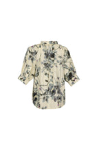 A cream-colored short-sleeve blouse with a black and gray floral print, shown from the back against a light blue-gray background.
do29di.4059
hannes roether