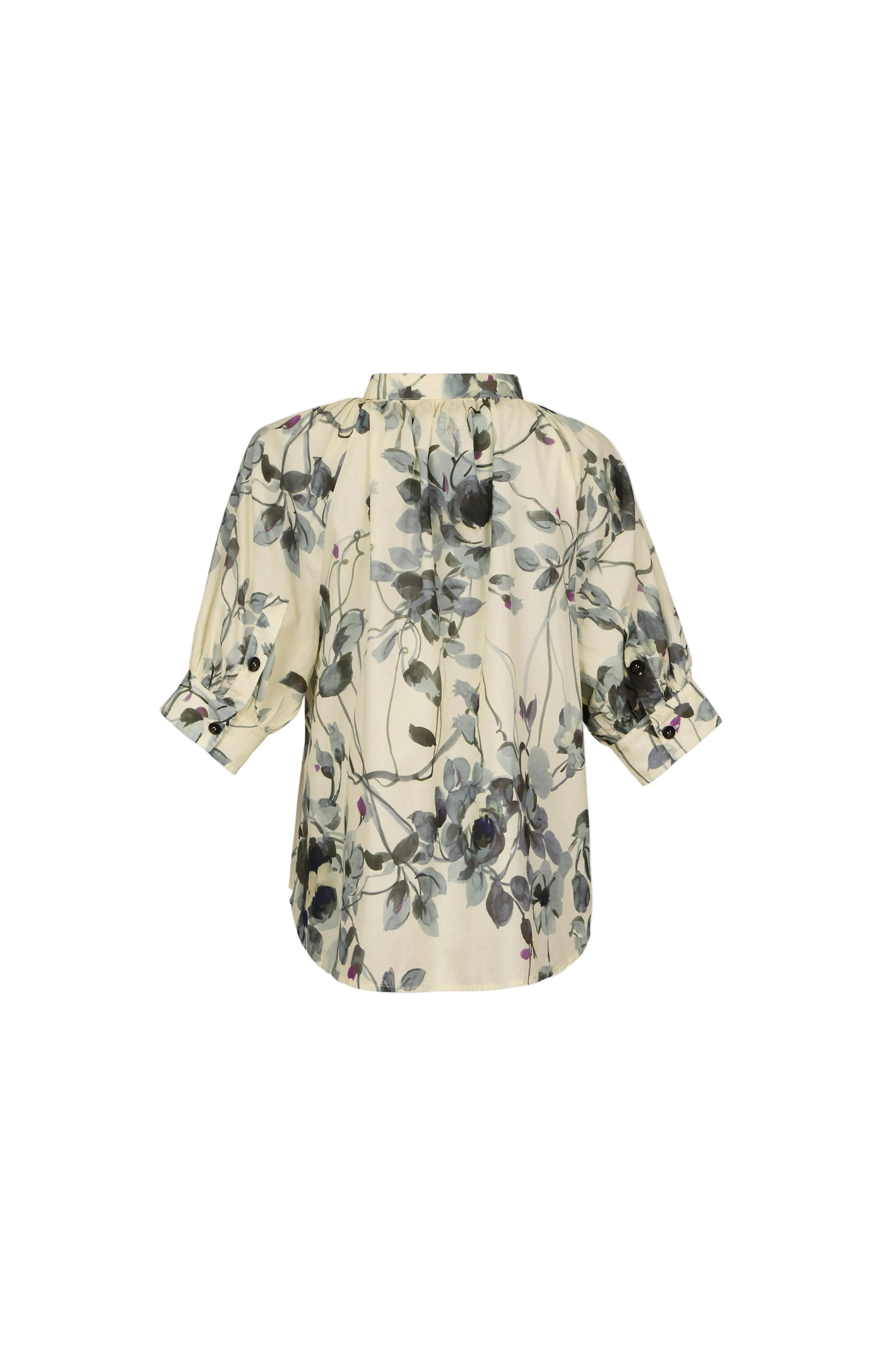 A cream-colored short-sleeve blouse with a black and gray floral print, shown from the back against a light blue-gray background.
do29di.4059
hannes roether