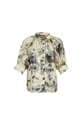 A women's short-sleeve blouse with a gathered, ruffled neckline and a watercolor-style floral print in muted gray, black, and soft pink on a cream background, shown against a light blue-gray studio background.

do29di.4059
hannes roether