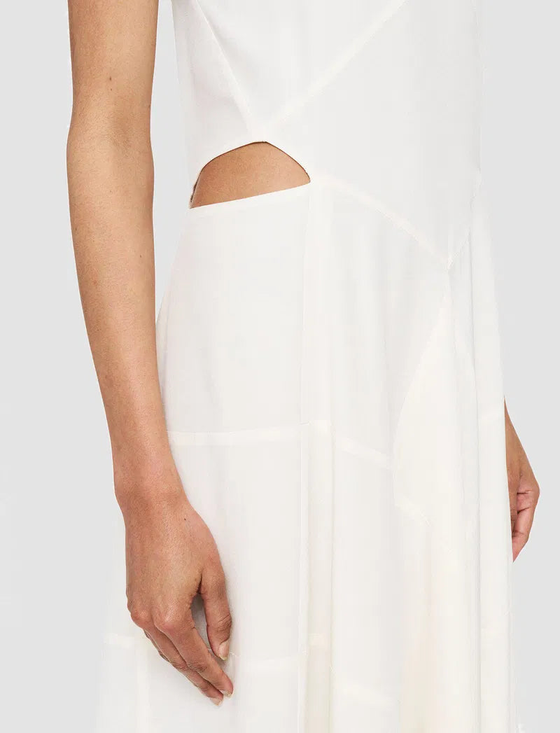 White dress with cut-out design on a white background