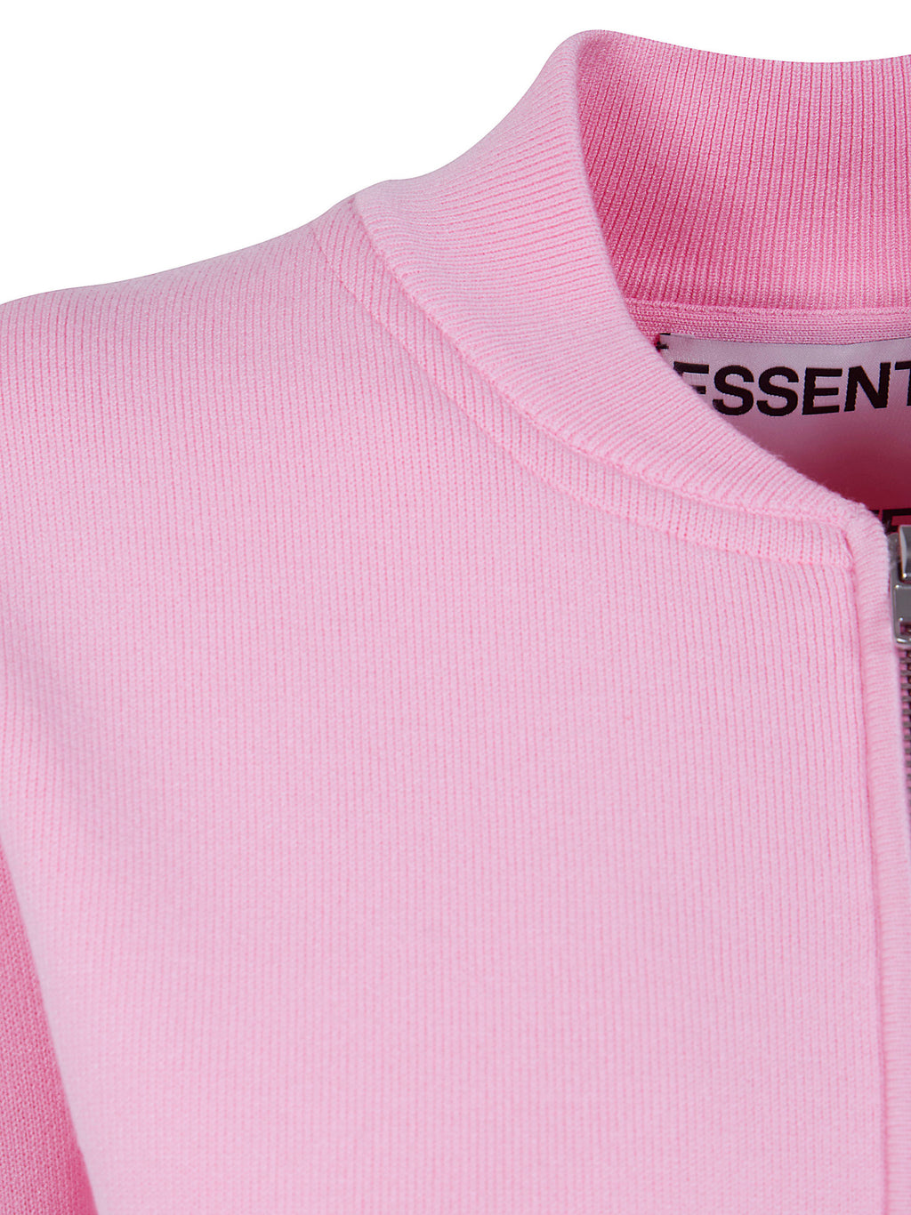 Close-up of a pink jacket with a brand label on a white background