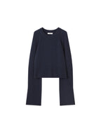 Navy blue sweater and pants set on a light gray background