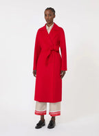 Person wearing a red coat on a white background