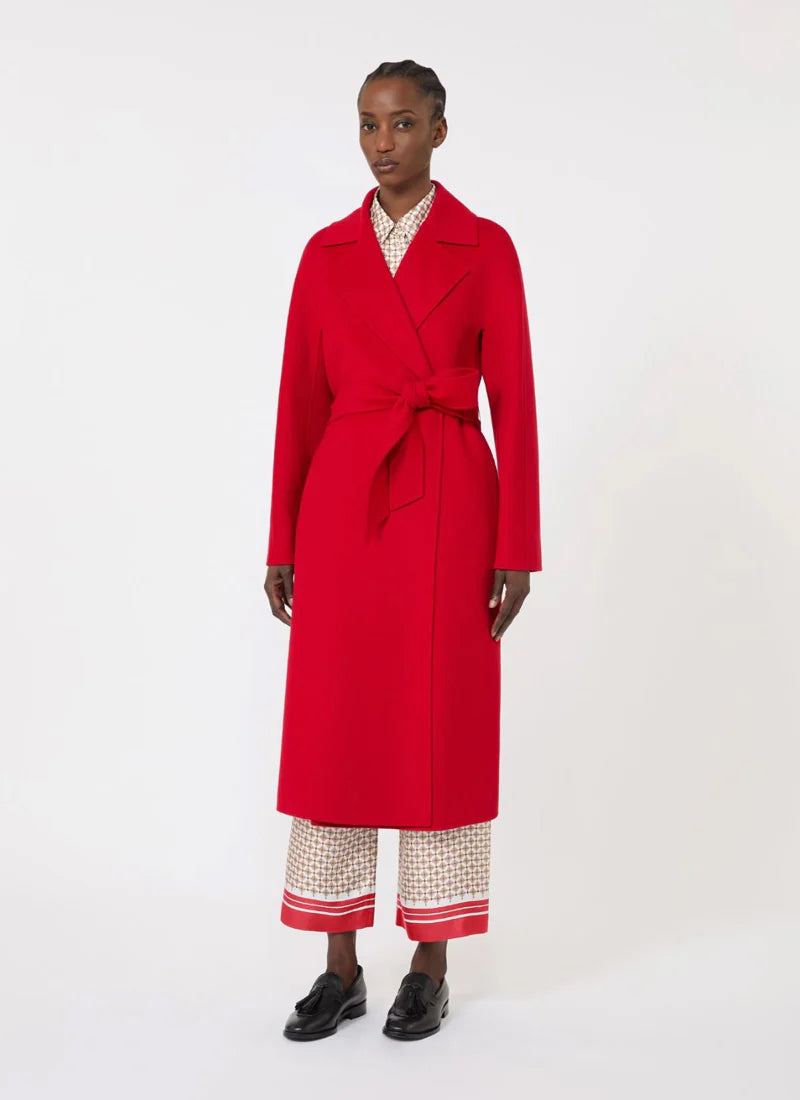 Person wearing a red coat on a white background