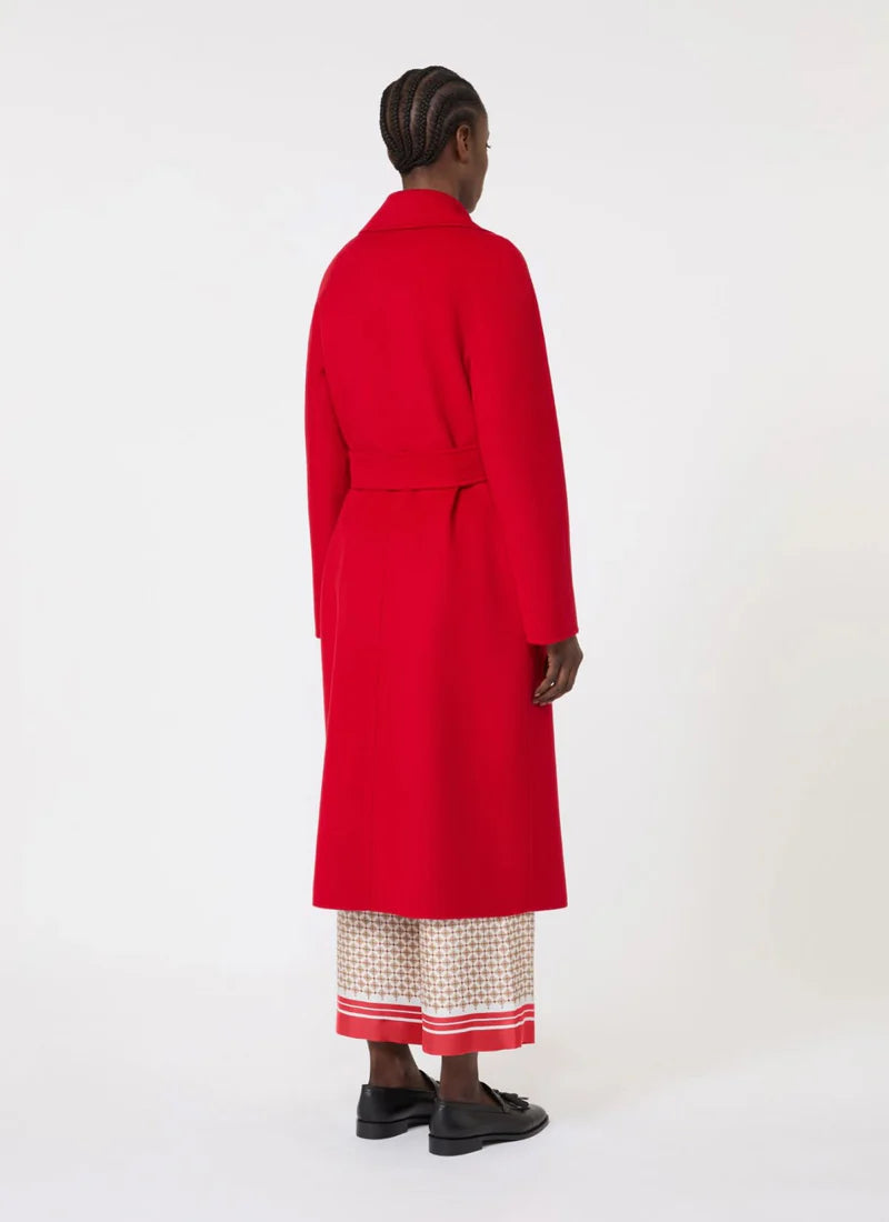 Person wearing a red coat on a white background