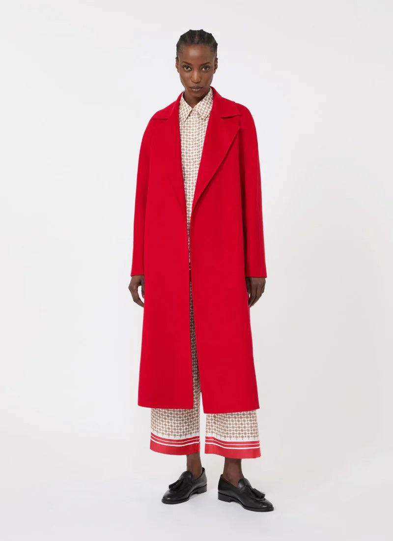 Person wearing a red coat on a white background