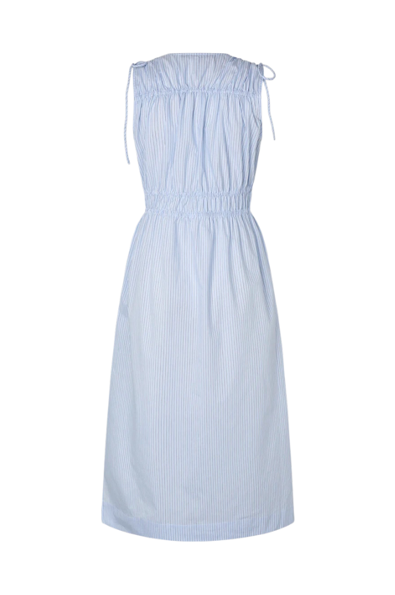 A light blue and white vertically striped sleeveless dress with a smocked bodice, tie straps at the shoulders, and a gathered skirt, shown against a plain white background.