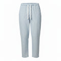 Light blue ribbed knit lounge pants with a white drawstring, shown on a plain white background.