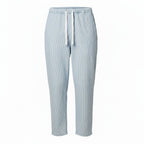 Light blue ribbed knit lounge pants with a white drawstring, shown on a plain white background.