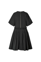 A black short-sleeve dress shown from the back, featuring a central silver zipper and a gathered waistband, displayed on a solid white background.