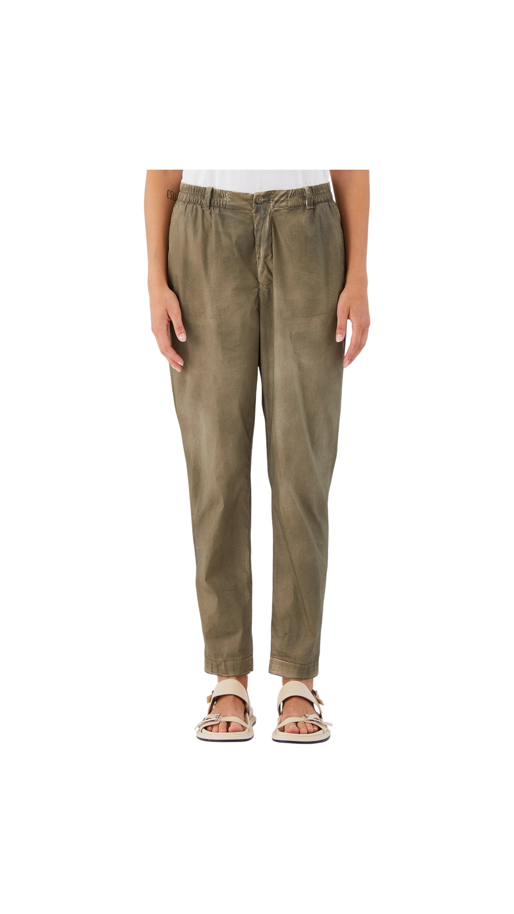 Person wearing olive green pants on a white background