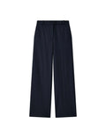 navy Yukio cotton gabardine pants on a light gray background