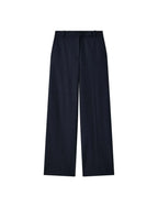 navy Yukio cotton gabardine pants on a light gray background
